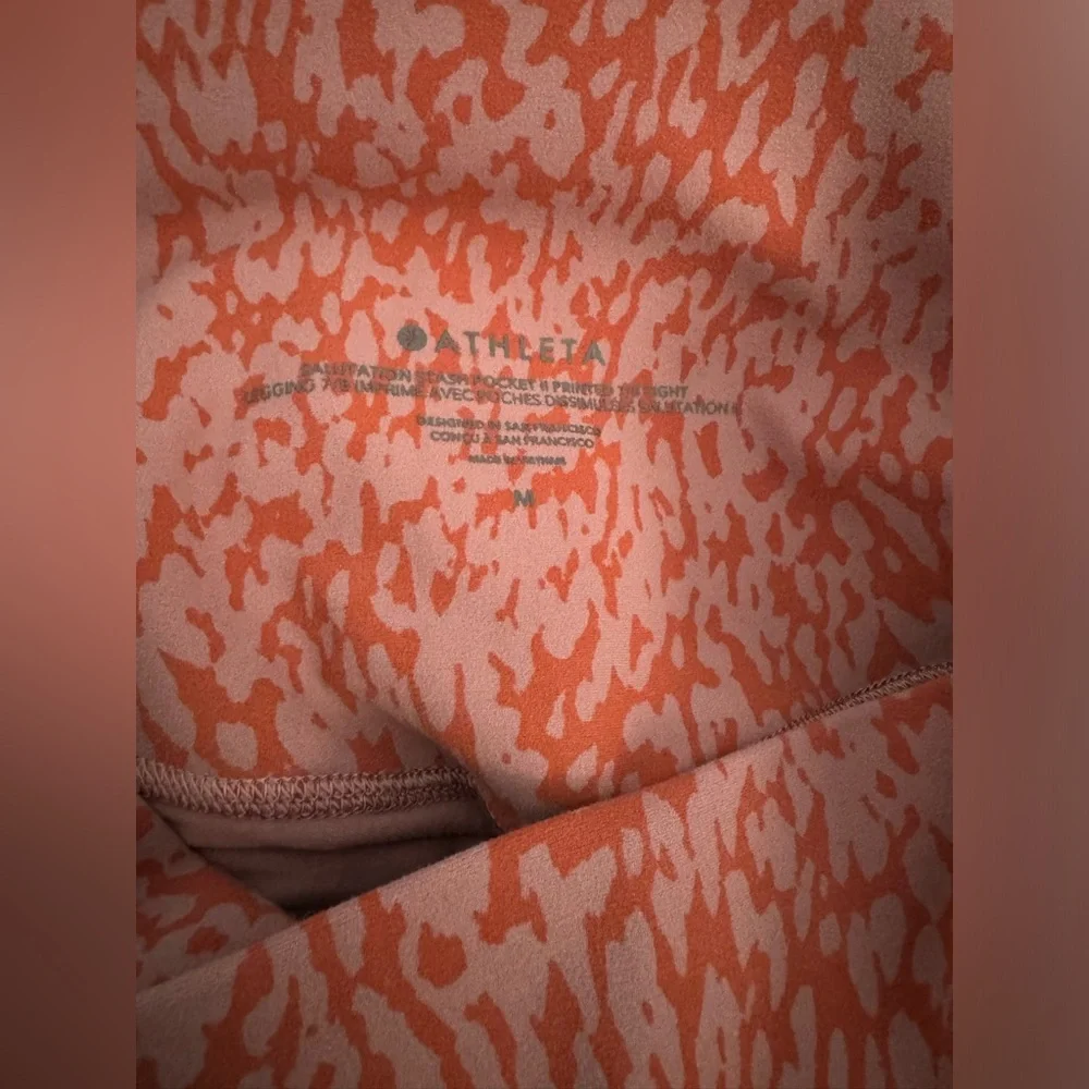 Athleta Salutation Stash Pocket II Printed 7/8 Tight Ocelot Spot Jewel Orange